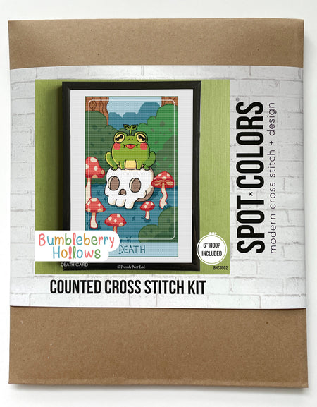 Counted cross stitch kit packaging with a cartoon frog design on a white background
