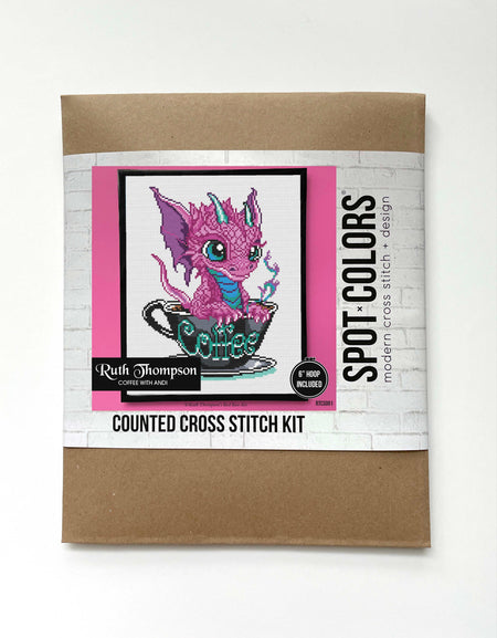 Counted cross stitch kit packaging with a dragon design on a white background
