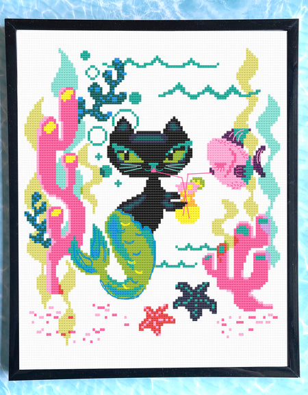 Cross-stitched design of a black cat mermaid with colorful sea-themed elements on a white background.