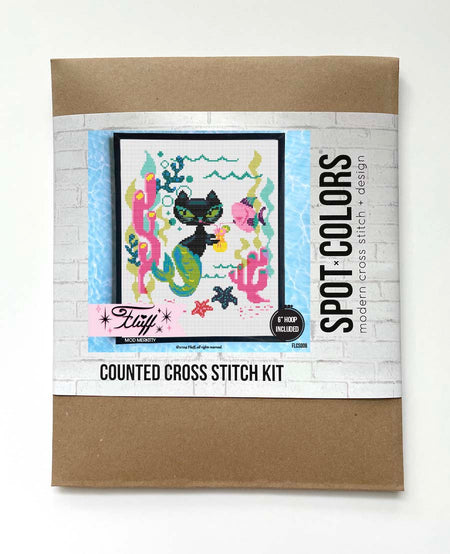 Counted cross stitch kit packaging with a cat-themed design on a white background