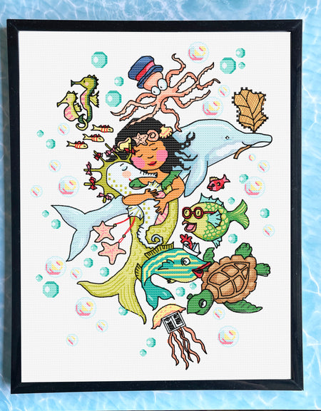 Framed artwork of a mermaid surrounded by sea creatures on a blue watercolor background.
